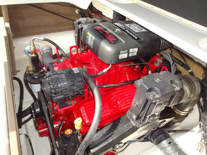 Slide: The Image of 2005 Glastron SX195 boat engine, featuring a red and black design with visible components. - 8