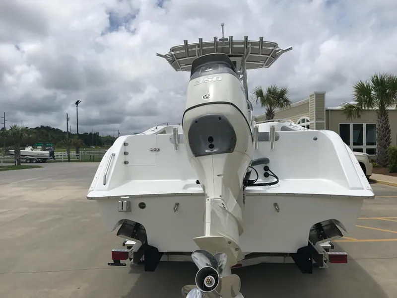 Slide: The Image of 2024 Cape Horn 22OS boat rear view with outboard motor. - 2