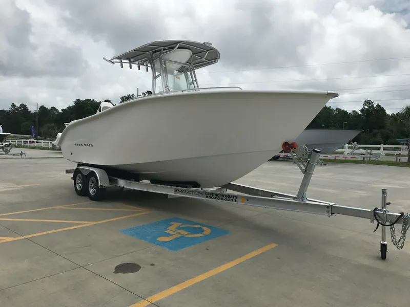 Slide: The Image of 2024 Cape Horn 22OS boat on a trailer in a parking lot. - 4