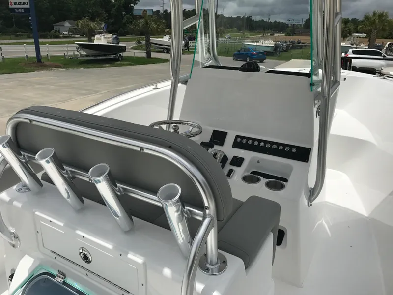 Slide: The Image of 2024 Cape Horn 22OS boat interior with helm station and rod holders. - 6