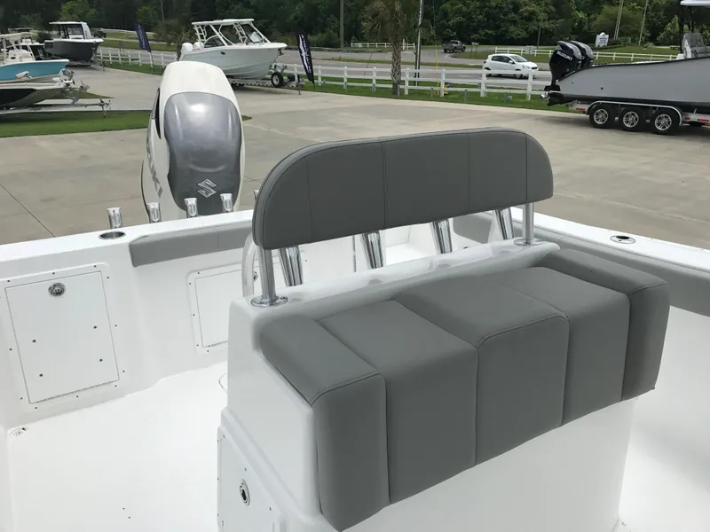 Slide: The Image of 2024 Cape Horn 22OS boat with gray seating and outboard motor. - 8