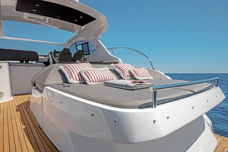 Slide: The Image of 2023 Azimut A45 yacht with sunbathing area and ocean view. - 12