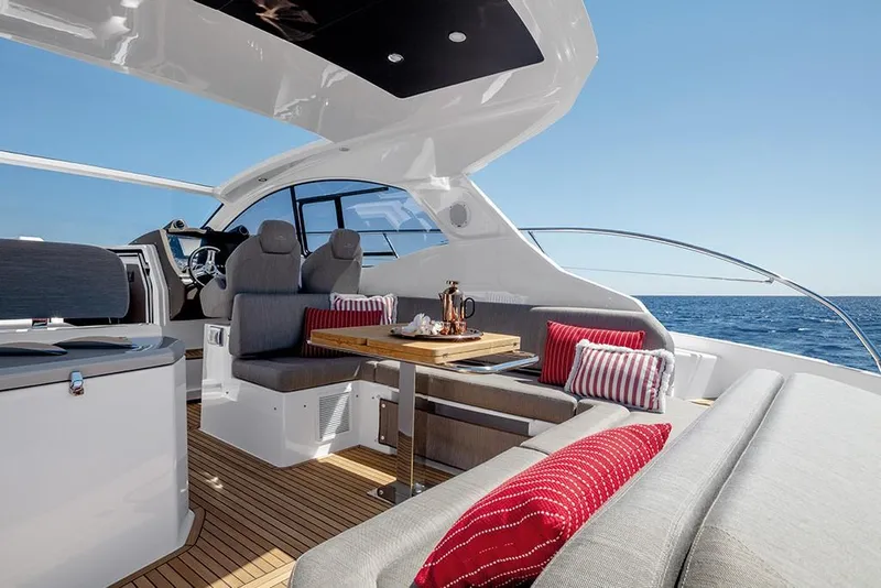 Slide: The Image of 2023 Azimut A45 yacht interior with seating and dining area. - 16