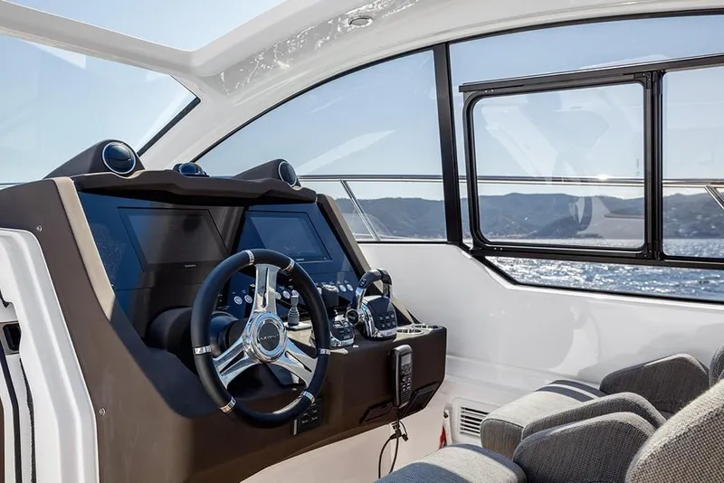 Slide: The Image of 2023 Azimut A45 yacht helm station with modern controls and ocean view. - 17