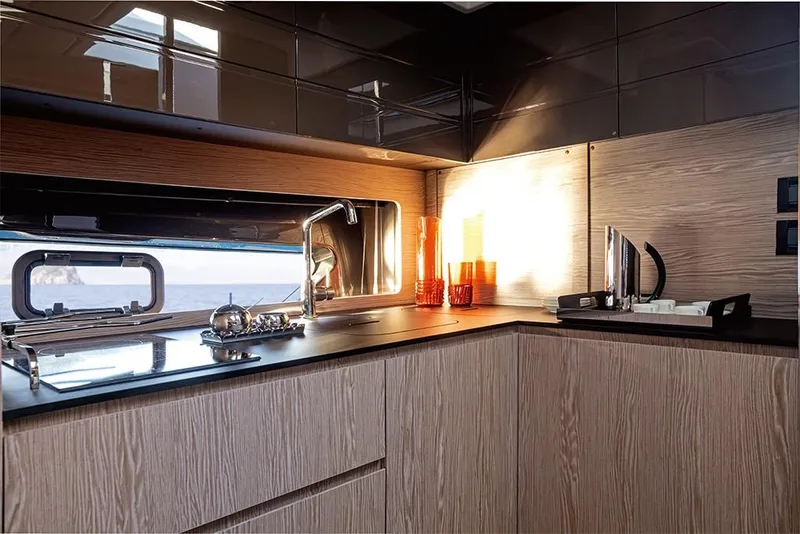 Slide: The Image of Modern kitchen interior of 2023 Azimut A45 yacht with sleek cabinetry and stainless steel fixtures. - 19