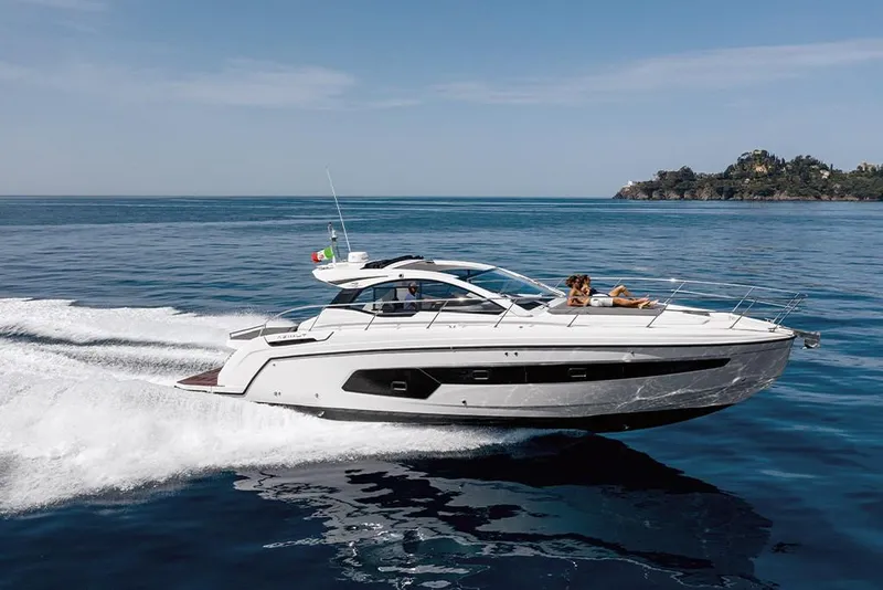 Slide: The Image of 2023 Azimut A45 yacht cruising on open water. - 2