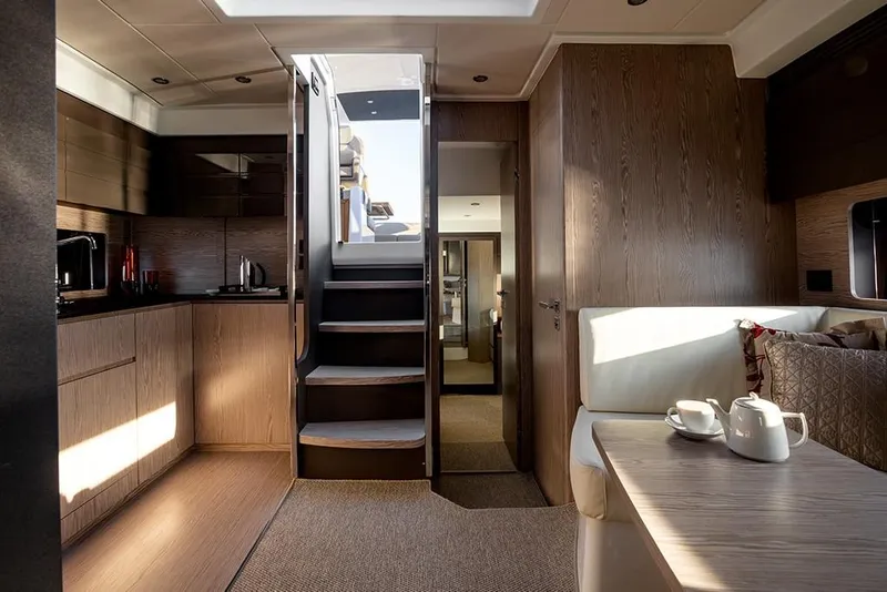 Slide: The Image of Luxurious interior of 2023 Azimut A45 yacht with modern kitchen and cozy seating area. - 22