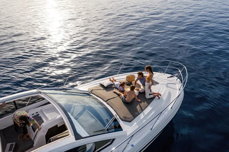 Slide: The Image of 2023 Azimut A45 yacht with people relaxing on deck in open water. - 8