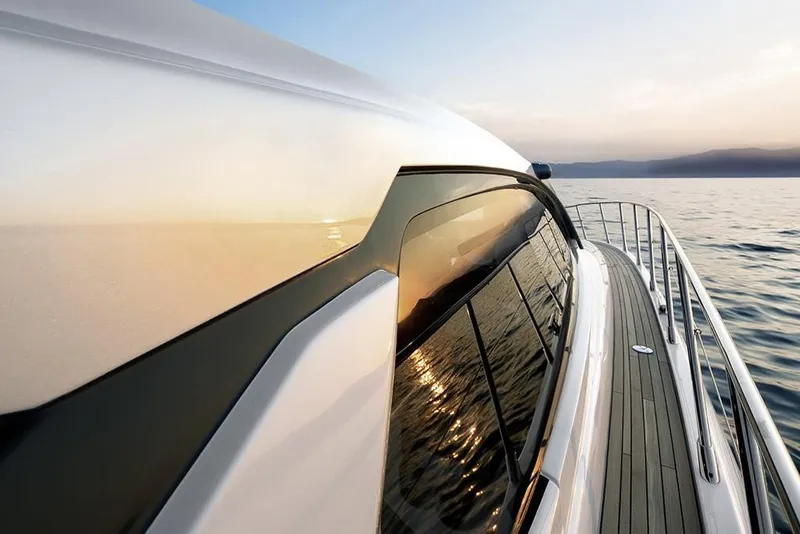 Slide: The Image of 2023 Azimut A45 yacht reflecting sunset on calm sea. - 9