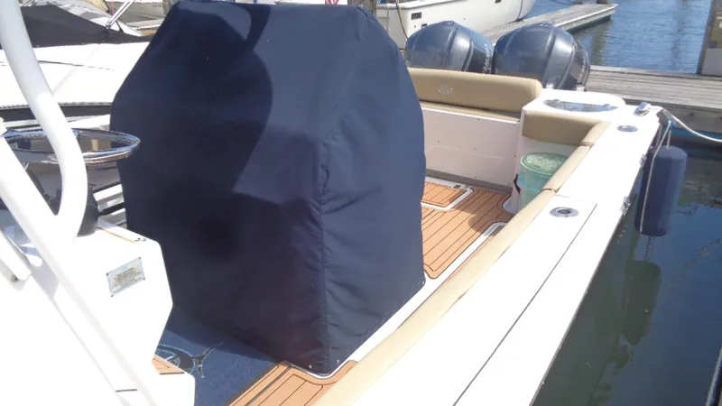 Slide: The Image of 2017 Sportsman 312 Open boat with covered console and twin engines at dock. - 12