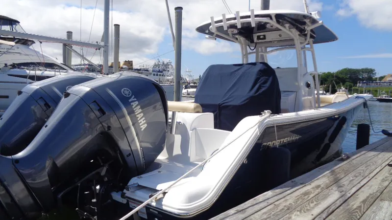 Slide: The Image of 2017 Sportsman 312 Open boat docked with twin Yamaha engines. - 2