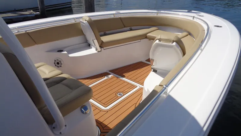 Slide: The Image of 2017 Sportsman 312 Open boat interior with tan seating and wooden deck. - 5