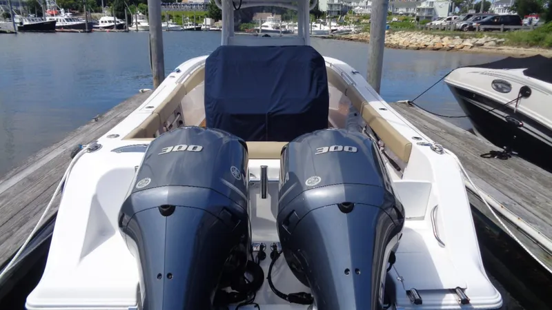 Slide: The Image of 2017 Sportsman 312 Open boat with dual 300 horsepower engines docked at marina. - 7