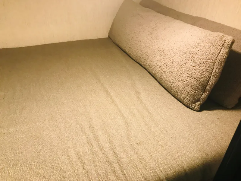 Slide: The Image of Cozy bed in Adonia Adonis Trip 3, 2018 model, with beige bedding and pillow. - 18