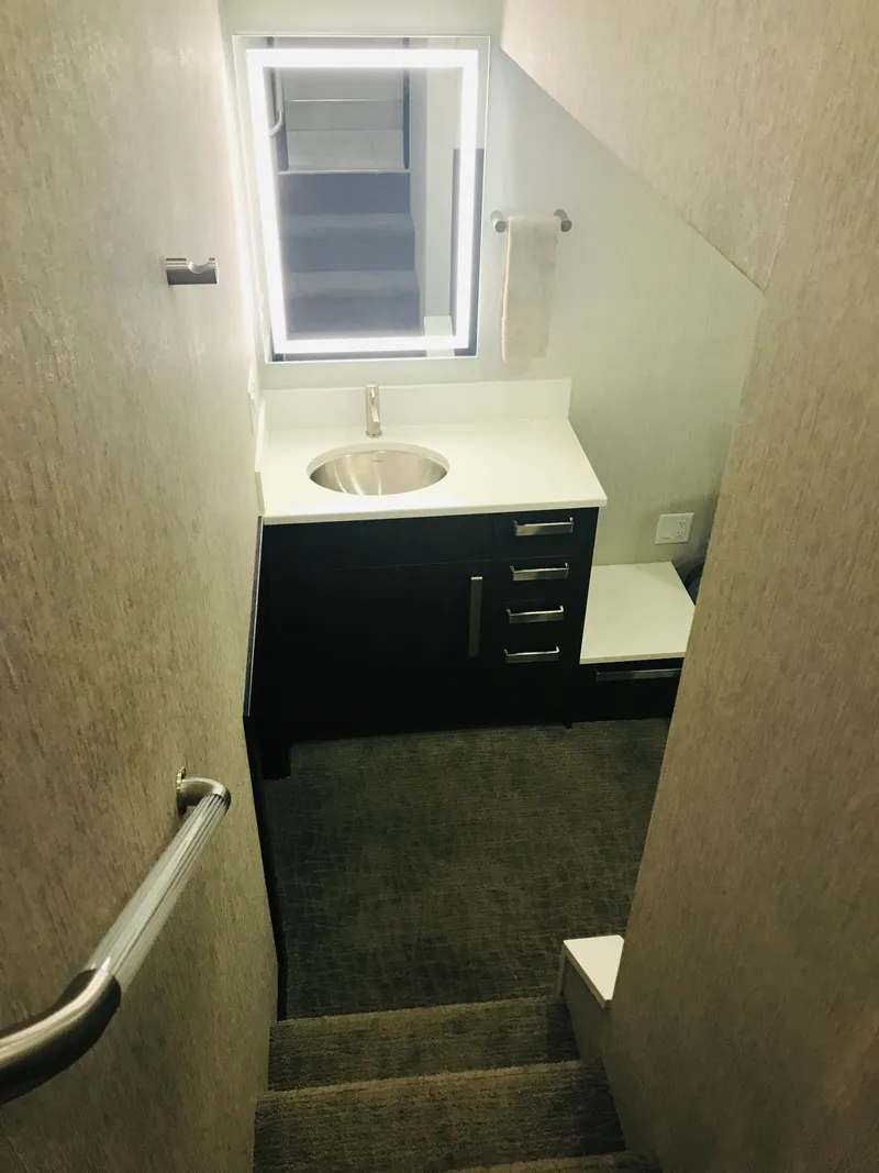 Slide: The Image of Compact bathroom in 2018 Adonia Adonis Trip 3 RV with sink and window. - 19