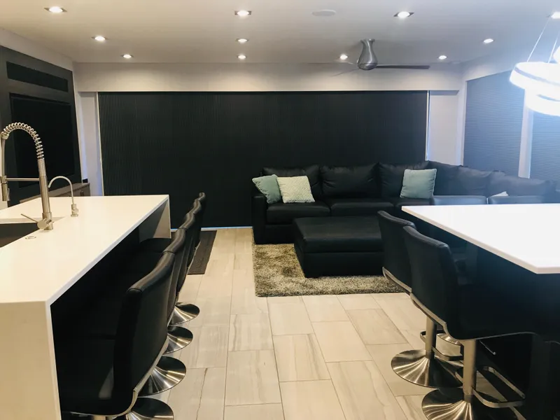 Slide: The Image of Modern RV interior with sleek kitchen, black sofa, and stylish lighting in Adonia Adonis Trip 3, 2018. - 20