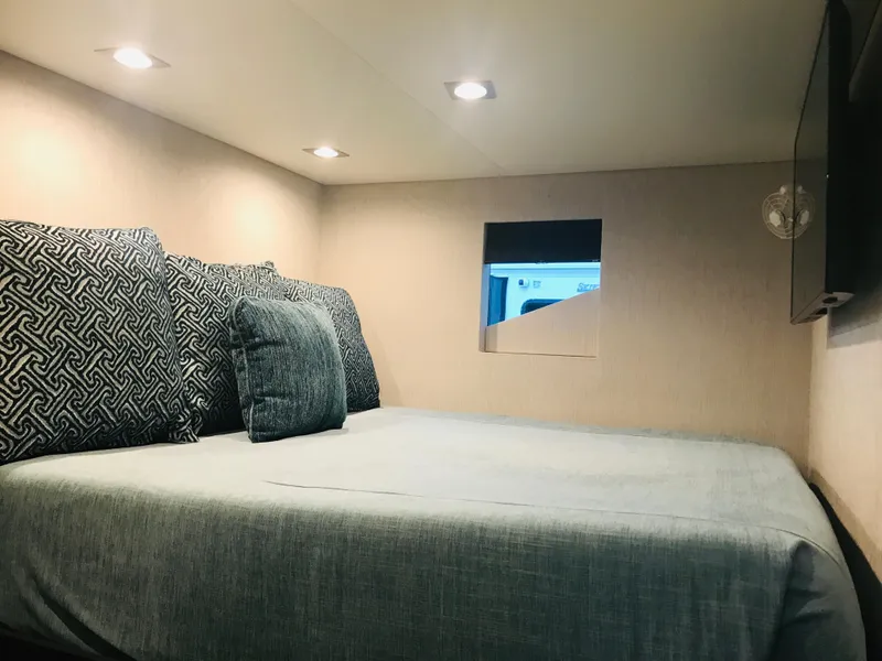 Slide: The Image of Cozy bedroom interior in 2018 Adonia Adonis Trip 3 RV with modern lighting. - 7