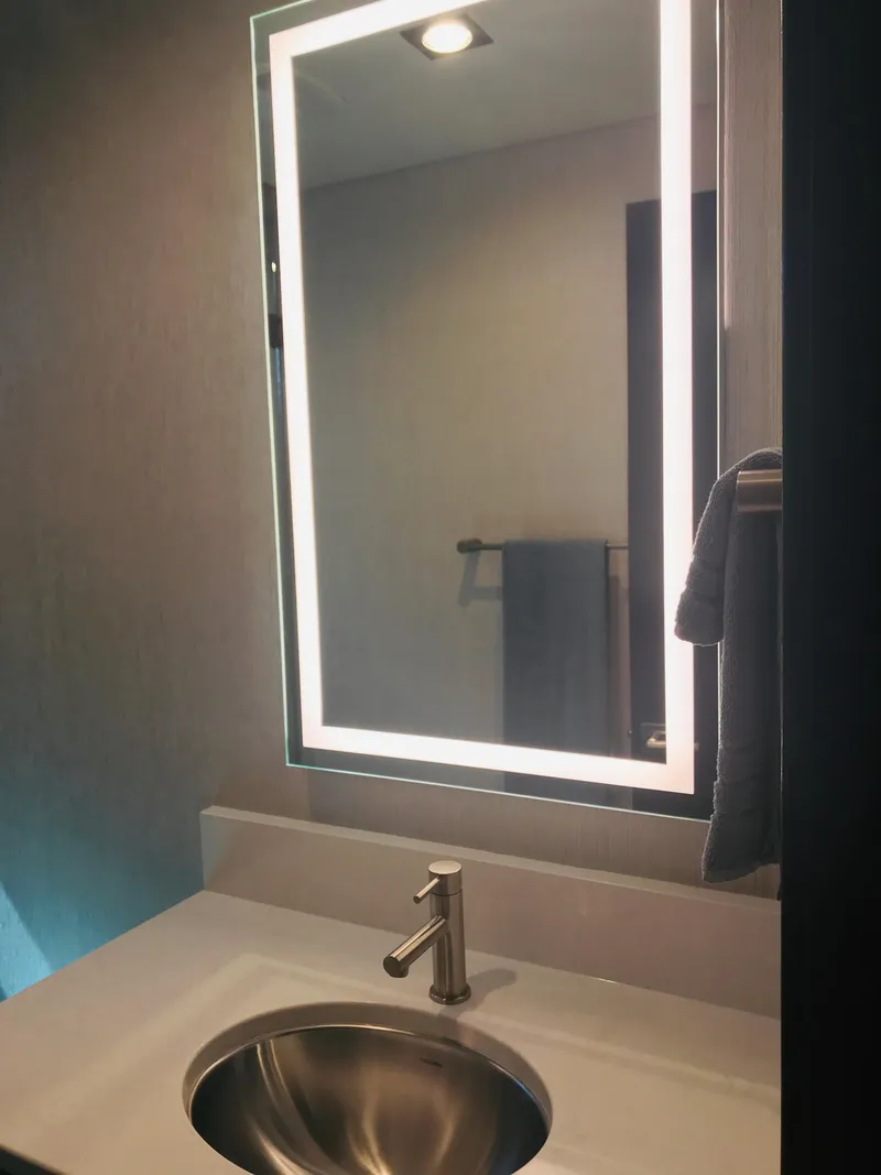 Slide: The Image of Modern bathroom with illuminated mirror and sleek sink, Adonia Adonis Trip 3, 2018. - 9