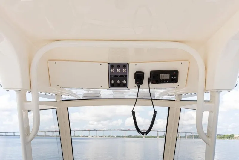 Slide: The Image of 2023 Scout 277 LXF boat console with radio and control panel. - 16