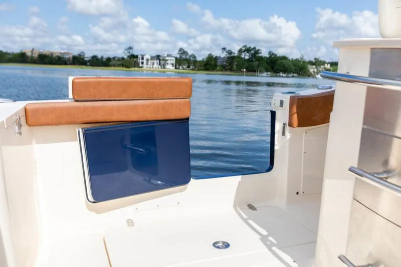 Slide: The Image of 2023 Scout 277 LXF boat interior with lake view. - 22