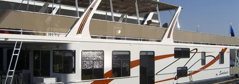 Slide: The Image of 2007 Stardust Cruisers Sundancer Trip 7 houseboat with upper deck and modern design. - 0