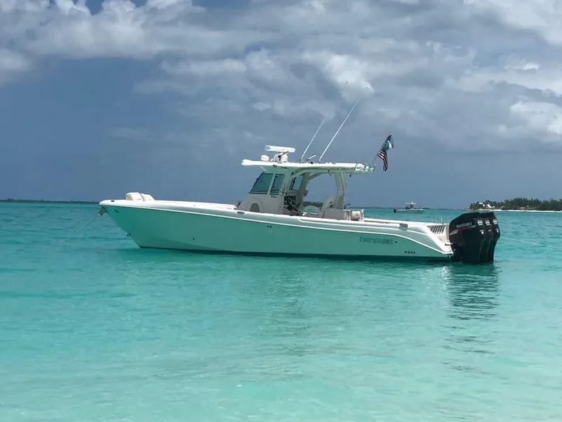 Slide: The Image of 2008 Everglades 350 CC boat on turquoise water under cloudy sky. - 10