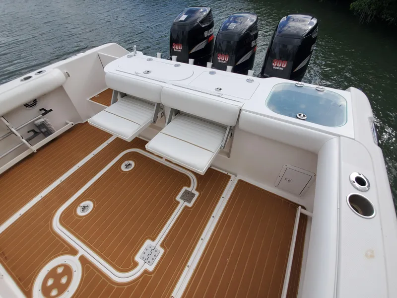 Slide: The Image of 2008 Everglades 350 CC boat with triple Suzuki 300 outboard engines and spacious deck. - 14