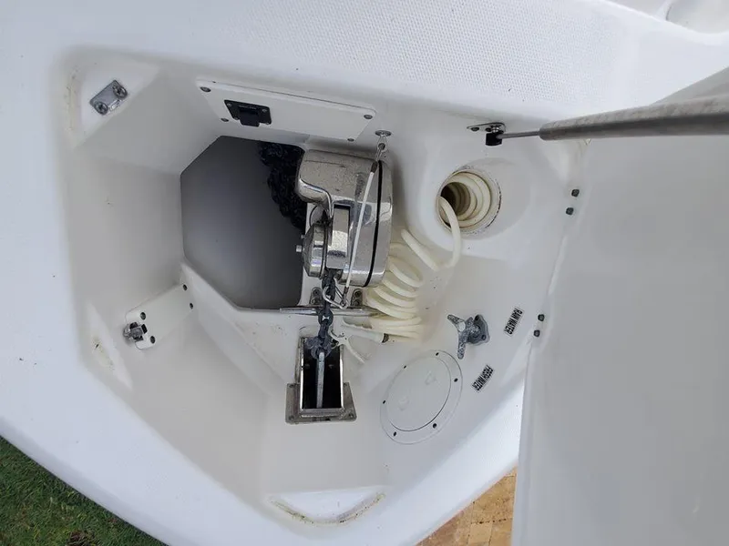 Slide: The Image of 2008 Everglades 350 CC anchor locker with windlass and hose. - 28