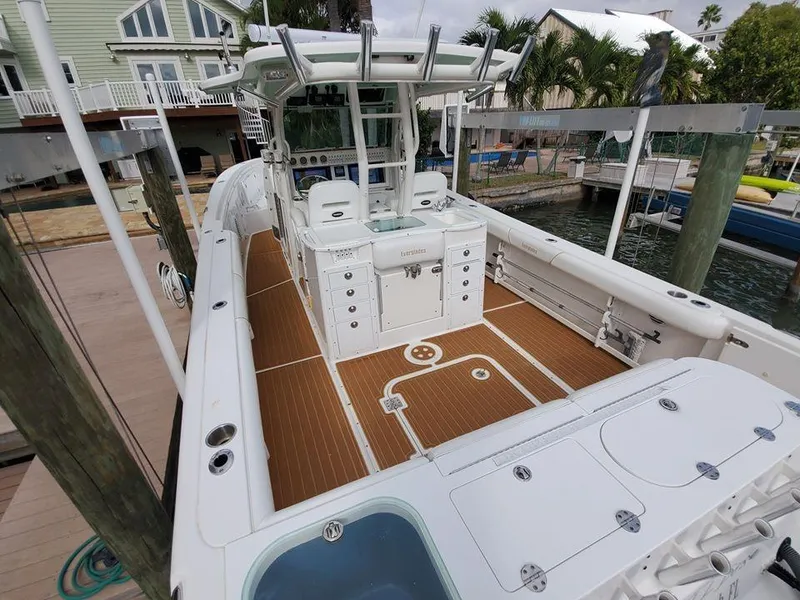 Slide: The Image of 2008 Everglades 350 CC boat docked, featuring spacious deck and modern amenities. - 41