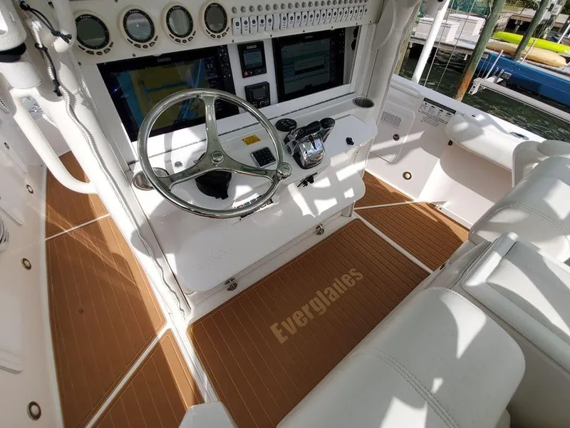 Slide: The Image of 2008 Everglades 350 CC boat cockpit with steering wheel and control panel. - 42