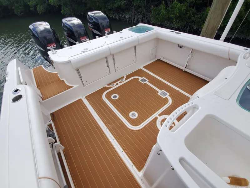 Slide: The Image of 2008 Everglades 350 CC boat deck with triple outboard motors. - 7