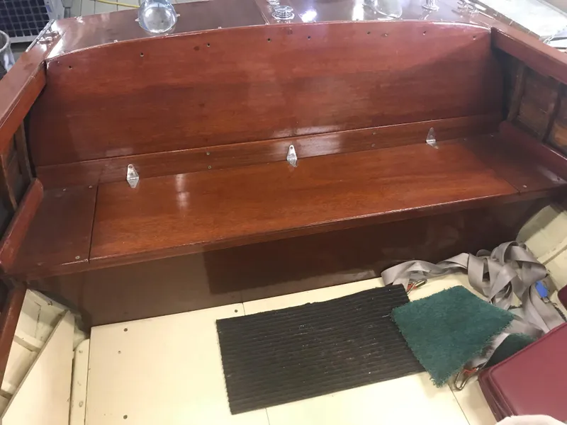 Slide: The Image of 1957 Lyman Islander wooden boat interior with bench seat and accessories. - 13