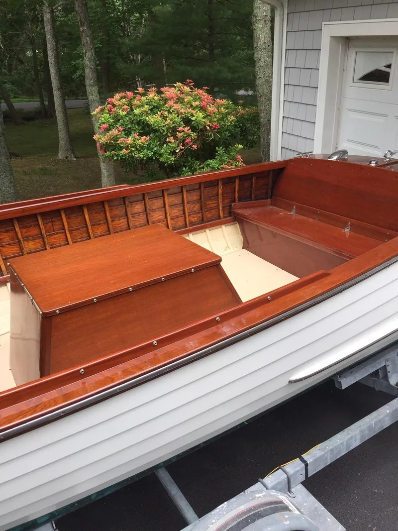 Slide: The Image of 1957 Lyman Islander wooden boat with polished interior on trailer. - 7