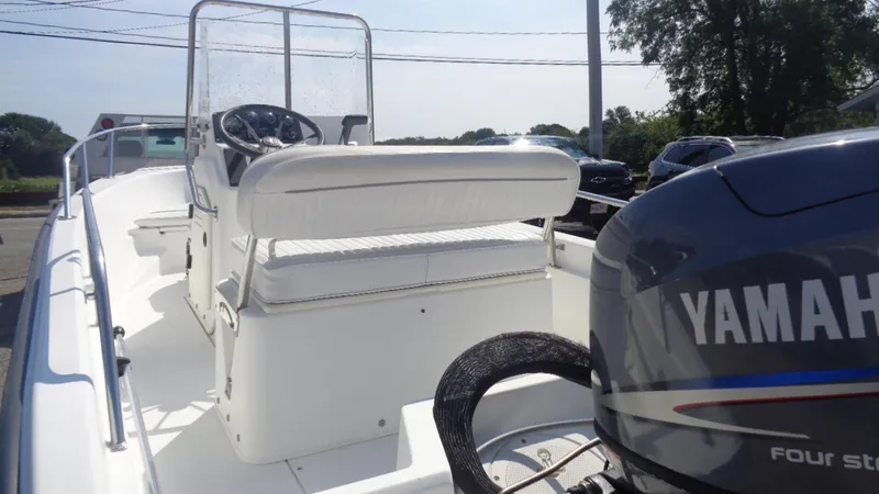 Slide: The Image of 1999 Boston Whaler 140 Dauntless boat with Yamaha four-stroke engine, white interior. - 6