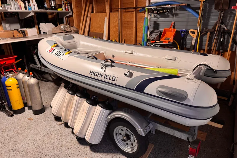 Slide: The Image of Inflatable boat in garage with scuba tanks, Jeanneau Sun Odyssey 419, 2017 model. - 17