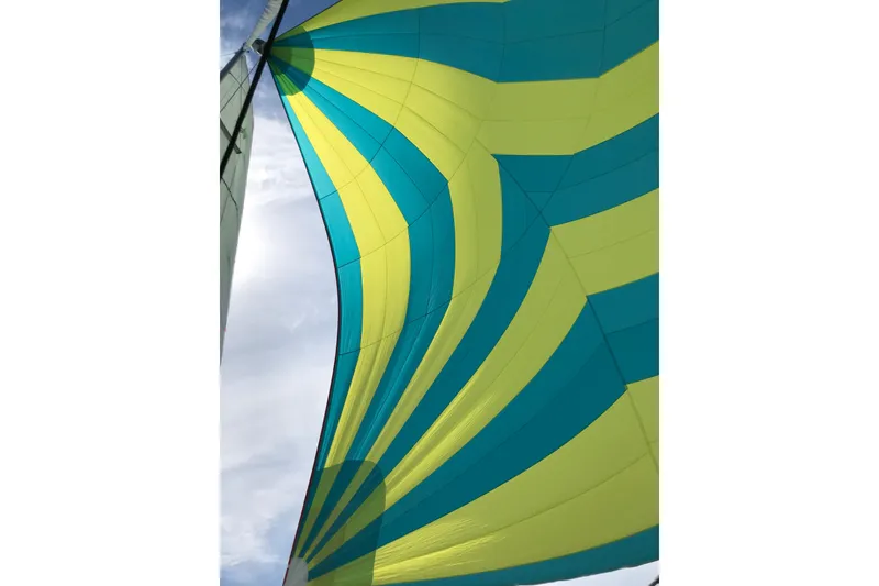 Slide: The Image of Colorful sail of 2018 Jeanneau Sun Odyssey 419 against a clear sky. - 5