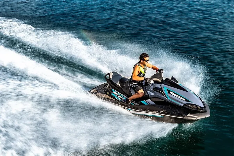 Slide: The Image of 2023 Kawasaki Ultra LX jet ski speeding on water - 3
