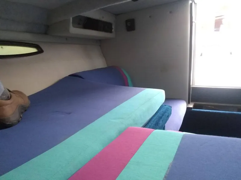 Slide: The Image of Interior cabin of 1988 Wellcraft 23 NOVA XL boat with colorful cushions. - 6