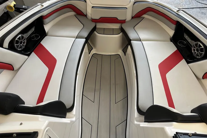 Slide: The Image of 2020 Yamaha Boats 242X interior with red and white seating, modern design. - 3