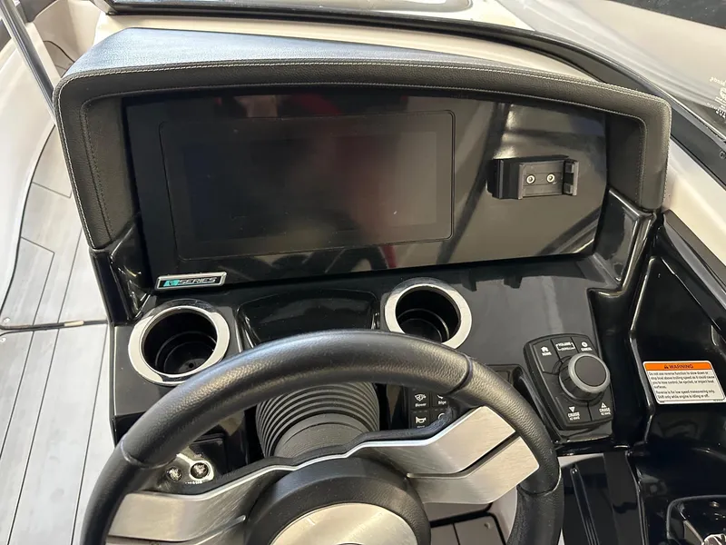 Slide: The Image of 2020 Yamaha Boats 242X dashboard with steering wheel and control panel. - 6