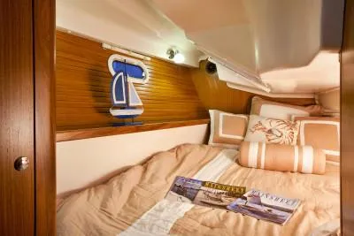 Slide: The Image of Cozy cabin interior of 2026 Catalina 316 sailboat with nautical decor and comfortable bedding. - 5