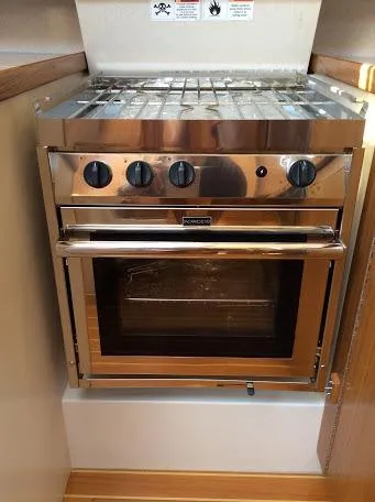 Slide: The Image of Stainless steel Catalina 426 oven and stove, 2026 model, in a compact kitchen setting. - 11