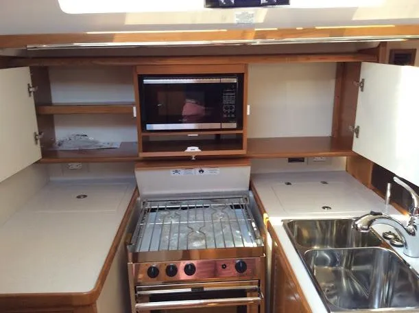 Slide: The Image of Modern kitchen in 2026 Catalina 426 yacht with stove, microwave, and sink. - 12