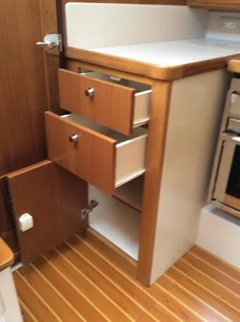 Slide: The Image of Wooden cabinetry with open drawers in a 2026 Catalina 426 yacht interior. - 13