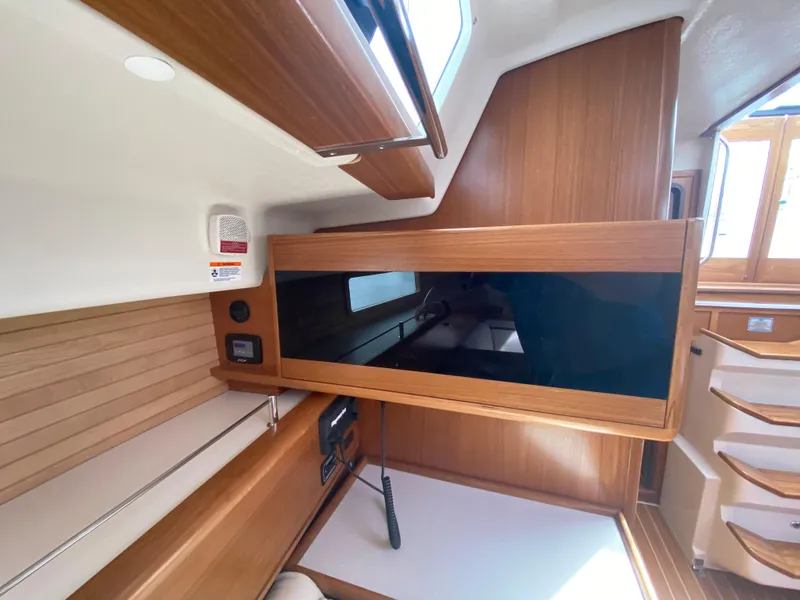 Slide: The Image of Modern Catalina 426 yacht interior, 2026 model, featuring sleek wood paneling and ample natural light. - 25