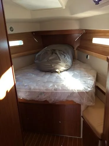 Slide: The Image of Cozy cabin interior of 2026 Catalina 426 sailboat with wooden accents and bedding. - 33