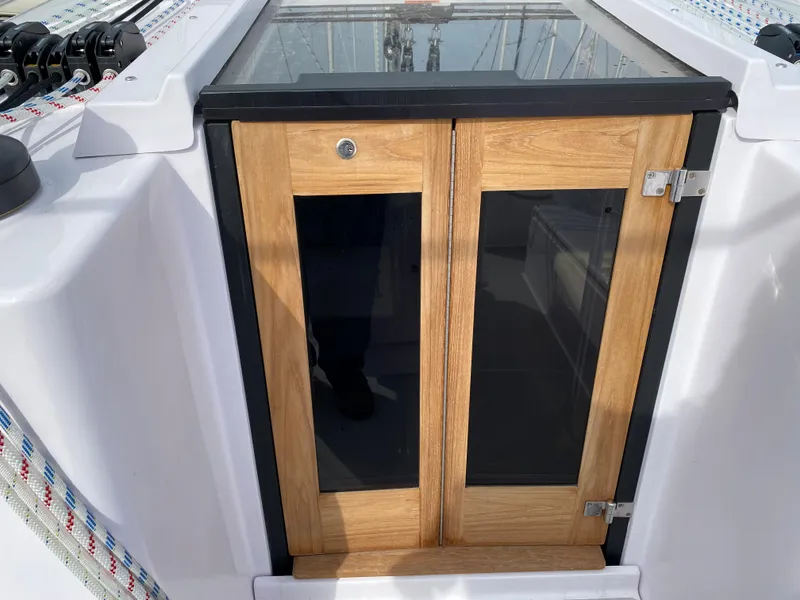 Slide: The Image of Wooden hatch doors on a 2026 Catalina 426 sailboat, featuring sleek design and modern hardware. - 36