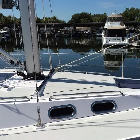 Slide: The Image of Sailboat Catalina 426, 2026 model, docked in a marina with calm waters. - 37