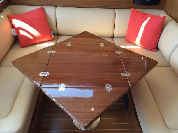 Slide: The Image of Luxurious Catalina 426 yacht interior with wooden table and beige seating, 2026 model. - 38