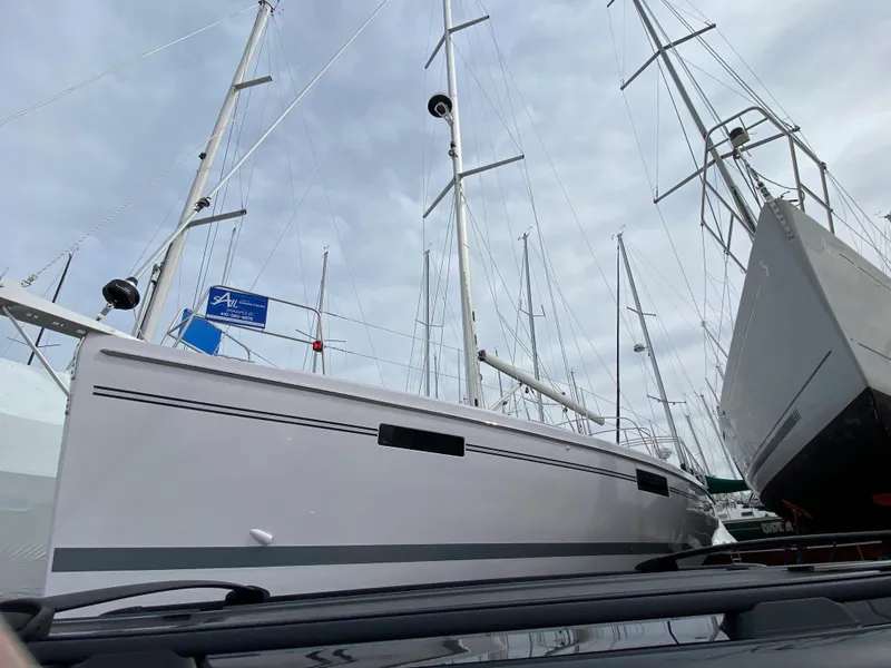 Slide: The Image of Modern Catalina 426 sailboat from 2026 docked among other vessels under a cloudy sky. - 4